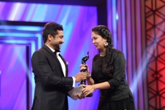 Actor Surya giving Best Actress Tamil Award to his wife Jyothika at 63rd Britannia Filmfare Awards South